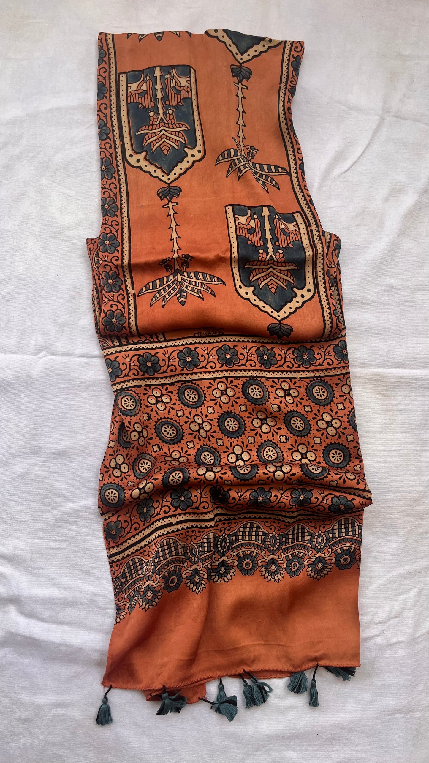 Kesari Jharokha and Kamdhenu Motif Ajrakh Hand Block Print Modal Silk Stole with Tassels