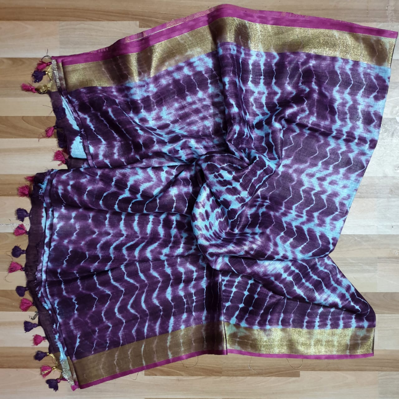 Aubergine Colour Tie and Dye Linen Saree with Golden Zari and Tassels