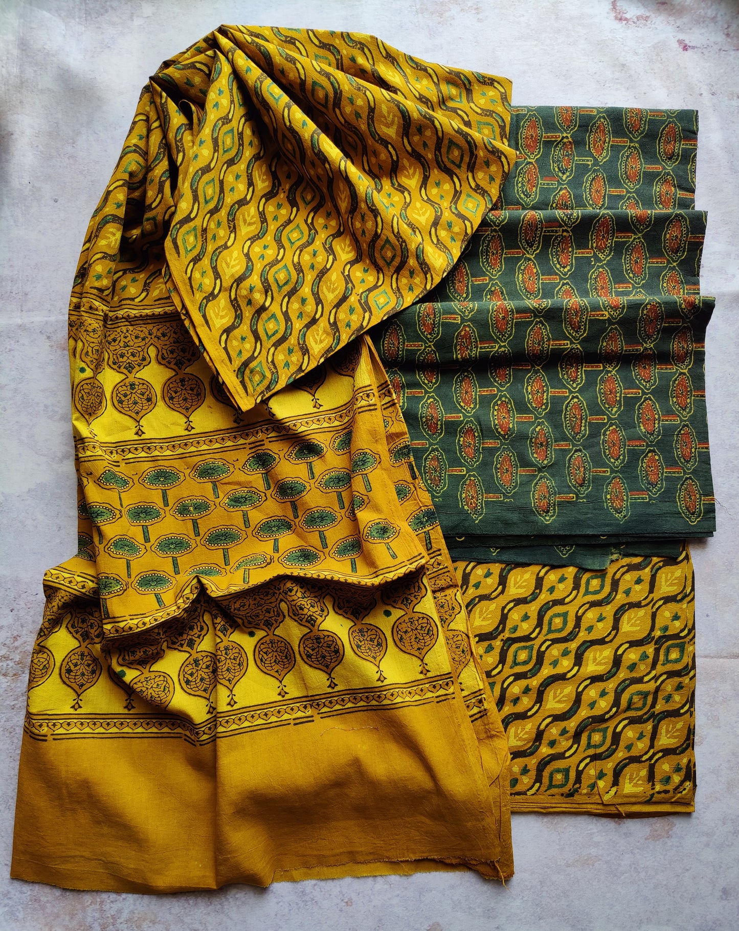 Yellow and Green Lotus Motif Ajrakh Unstitched Suit Set with Cotton Dupatta